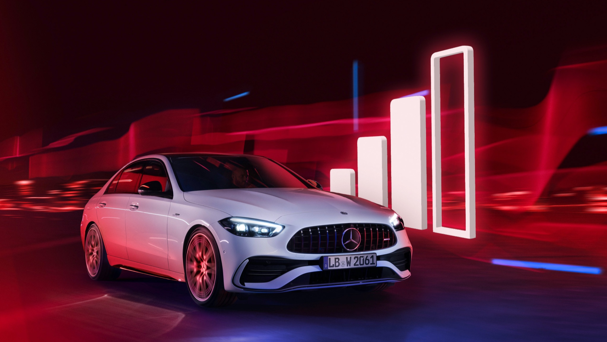 Volum de date tip Confort de la un furnizor terț | Entertainment | Mercedes-Benz Un model Mercedes-Benz trecând lângă vizualizarea unei coloane de recepție.